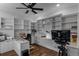 Home office with built-in shelving, hardwood floors, and large desk at 8279 Nemours Pkwy, Orlando, FL 32827
