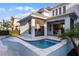 Luxury pool and spa with a screened-in patio at 8279 Nemours Pkwy, Orlando, FL 32827