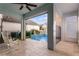 Relaxing pool area with a covered patio and comfortable rocking chairs at 8279 Nemours Pkwy, Orlando, FL 32827