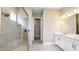 Bathroom boasts double vanity, large shower, and walk-in closet at 857 Arbor Green Trl, St Cloud, FL 34771