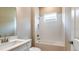 Clean bathroom with a tub, shower and single vanity at 857 Arbor Green Trl, St Cloud, FL 34771