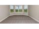 Bedroom with bay window and wall-to-wall carpeting at 857 Arbor Green Trl, St Cloud, FL 34771