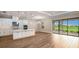 Bright kitchen features an island, stainless steel appliances & sliding doors to patio at 857 Arbor Green Trl, St Cloud, FL 34771
