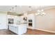 Spacious kitchen with white cabinets, stainless steel appliances and large island at 857 Arbor Green Trl, St Cloud, FL 34771