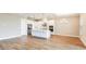 Spacious kitchen with white cabinets, stainless steel appliances, and island at 857 Arbor Green Trl, St Cloud, FL 34771