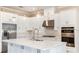 Spacious kitchen with white cabinets, stainless steel appliances, and large island at 857 Arbor Green Trl, St Cloud, FL 34771