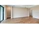 Bright living room with wood-look tile floors and neutral walls at 857 Arbor Green Trl, St Cloud, FL 34771