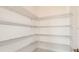 Walk-in pantry with ample shelving for storage at 857 Arbor Green Trl, St Cloud, FL 34771