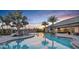 Relaxing resort-style pool with lounge chairs and sunset views at 857 Arbor Green Trl, St Cloud, FL 34771