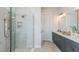 Bathroom features double vanity, walk-in shower, and modern finishes at 863 Arbor Green Trl, St Cloud, FL 34771
