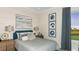 Spacious bedroom with a plush bed and serene golf course views at 863 Arbor Green Trl, St Cloud, FL 34771