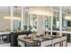 Elegant dining room with a stunning chandelier and mirrored wall at 863 Arbor Green Trl, St Cloud, FL 34771