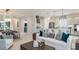 Open living room with white sofa and dining area at 863 Arbor Green Trl, St Cloud, FL 34771
