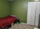 Small bedroom with a single bed and closet at 910 Rangeline Rd, Longwood, FL 32750