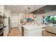 Spacious kitchen with a large island, stainless steel appliances, and white cabinets at 919 Tassleflower Trl, St Cloud, FL 34771