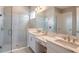 Double vanity bathroom with large shower and modern fixtures at 925 Tassleflower Trl, St Cloud, FL 34771