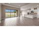Spacious living area with sliding glass doors leading to backyard at 925 Tassleflower Trl, St Cloud, FL 34771