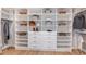 Organized walk-in closet with ample shelving, drawers, and hanging space at 932 Tassleflower Trl, Saint Cloud, FL 34771