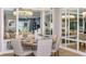 Elegantly furnished dining room with a round wooden table and mirrored walls at 932 Tassleflower Trl, Saint Cloud, FL 34771