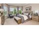 The main bedroom offers bay windows, plush carpeting, and a calming aesthetic at 932 Tassleflower Trl, Saint Cloud, FL 34771