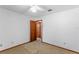 Simple bedroom with carpet flooring and an adjacent hallway at 120 Trafalgar Pl, Longwood, FL 32779