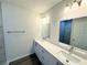 Modern bathroom with double vanity, quartz countertop, and a separate shower at 1202 Alafia Way, Poinciana, FL 34759