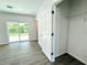 Bright bedroom with sliding door to backyard and a large closet at 1314 Hillsborough Ct, Poinciana, FL 34759