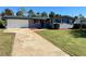 Newly painted home with attached garage and neat lawn at 1545 Culverhouse Dr, Daytona Beach, FL 32117