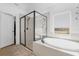 Bathroom with a shower and garden tub, great for relaxing at 1651 Kingfisher Ct, Kissimmee, FL 34746