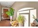 Relaxing front patio with seating area and potted plants at 1651 Kingfisher Ct, Kissimmee, FL 34746