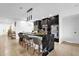 Modern kitchen with black cabinetry and large island at 1651 Kingfisher Ct, Kissimmee, FL 34746