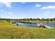 Private backyard with lake access, dock and pontoon boat at 1651 Kingfisher Ct, Kissimmee, FL 34746
