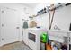 Laundry room with washer, dryer, utility sink and shelving at 1651 Kingfisher Ct, Kissimmee, FL 34746