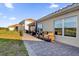 Large backyard patio with seating area, perfect for entertaining at 1651 Kingfisher Ct, Kissimmee, FL 34746