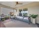 Relaxing screened porch with seating and a view of the backyard at 1651 Kingfisher Ct, Kissimmee, FL 34746