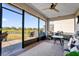 Spacious screened-in porch overlooking the backyard and lake at 1651 Kingfisher Ct, Kissimmee, FL 34746