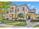 Two-story townhome with inviting front porch and landscaped lawn at 1812 Arbor Lakes Cir # 1812, Sanford, FL 32771