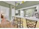 Modern kitchen with white cabinets, quartz countertops, and stainless steel appliances at 1812 Arbor Lakes Cir # 1812, Sanford, FL 32771