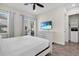 Bedroom with a king-size bed, dresser, and access to a private balcony at 2972 Salted Rim Rd, Kissimmee, FL 34747