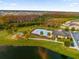 Community pool with lounge chairs and a playground nearby at 3993 Baja Dr, Saint Cloud, FL 34772