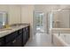 Primary bathroom with double vanity, large shower, and tub at 4428 Kaipo Rd, Davenport, FL 33897