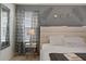 Bedroom with a king-size bed and stylish decor at 4428 Kaipo Rd, Davenport, FL 33897