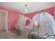 Two twin beds with canopy and princess decor at 4428 Kaipo Rd, Davenport, FL 33897