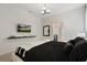 Spacious bedroom with TV, ensuite bathroom access, and a comfortable bed at 4428 Kaipo Rd, Davenport, FL 33897