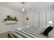 Bedroom with a queen bed, TV, and modern decor at 4428 Kaipo Rd, Davenport, FL 33897