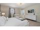 Spacious bedroom with a king-size bed, crib, dresser, and TV at 4428 Kaipo Rd, Davenport, FL 33897
