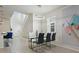 Bright dining room with glass table and modern chandelier at 4428 Kaipo Rd, Davenport, FL 33897