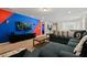 Game room with large TV, sectional sofa and media console at 4428 Kaipo Rd, Davenport, FL 33897