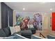 Game room with Avengers mural, sectional sofa, and media console at 4428 Kaipo Rd, Davenport, FL 33897