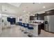 Modern kitchen with breakfast bar and stainless steel appliances at 4428 Kaipo Rd, Davenport, FL 33897